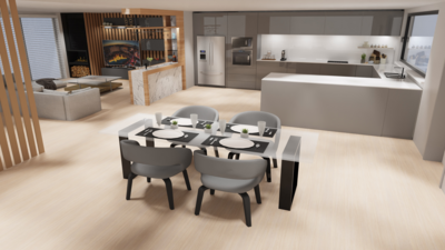 Offene moderne Küche mit grauen Schränken, Insel und Essbereich mit weißem Tisch und vier grauen Stühlen, im Hintergrund Wohnzimmer mit Kamin